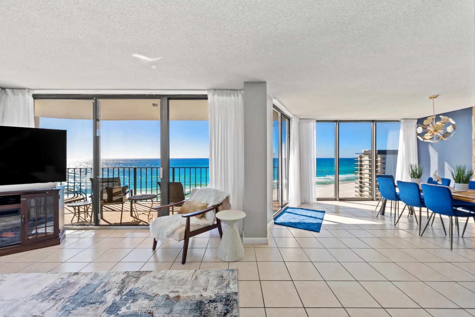 Luxury oceanfront condo living room with panoramic sea views – Threshold Property Management  