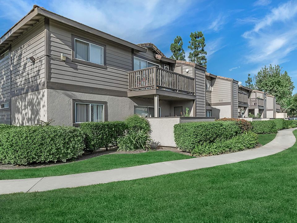 Garden-style apartment exterior at Pinecrest, a Threshold Management community