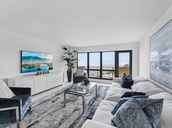 Modern living room with balcony view at a Threshold Management property